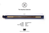 A wooden Haschka collection wand presented in its open white and navy blue box, with product specifications and branding printed below on a white background.