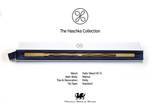 A long wooden wand presented in an open white and navy gift box, with branding text reading 'The Haschka Collection' and product details below on a white background.