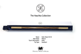 A wooden Haschka collection wand presented in its open white and navy blue box, with product specifications printed below on a white background.