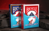 Invisible Deck Bicycle Playing Cards Magic Trick stood on rocks with a glowing red cave background.