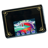 A quality close-up pad / mat in black,  standard sized with an ace border design. Perfect for performing with cards, coins and other small magic props. Sold by Red Dragon Magic.